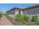 Side view of well maintained property with landscaped garden and seamless design at 6120 Plateau Ct, Bradenton, FL 34203
