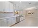 Open concept kitchen with stainless steel appliances, an island with a sink, and pendant lighting at 6120 Plateau Ct, Bradenton, FL 34203