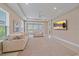 Bright, spacious living room with recessed lighting, modern decor, and expansive sliding glass doors at 6120 Plateau Ct, Bradenton, FL 34203