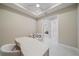 Bright office area with a ceiling fan, modern desk, and comfortable seating at 6120 Plateau Ct, Bradenton, FL 34203