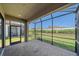 Screened-in patio with brick flooring and a view of the landscaped backyard and privacy fence at 6120 Plateau Ct, Bradenton, FL 34203