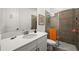 This bathroom features a shower, white cabinets and countertop, and a modern design at 6266 Mesa Gln, Bradenton, FL 34203