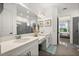 This bathroom features dual sinks, a walk-in shower, and lots of counter space at 6266 Mesa Gln, Bradenton, FL 34203