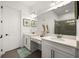 This is a clean bathroom offering a vanity, framed mirrors, and modern fixtures at 6266 Mesa Gln, Bradenton, FL 34203