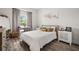 Inviting bedroom features a large window, wood floors, and neutral decor at 6266 Mesa Gln, Bradenton, FL 34203