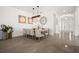 Bright dining room boasts seating for eight, tile floors, and decorative accents at 6266 Mesa Gln, Bradenton, FL 34203