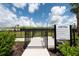Fenced dog park with lush green grass, providing a safe and fun environment for pets to play at 6266 Mesa Gln, Bradenton, FL 34203
