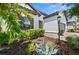 Detailed landscaping enhances the front yard of this inviting single-Gathering home at 6266 Mesa Gln, Bradenton, FL 34203