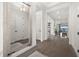 Hallway leading to spacious living area featuring sleek, modern flooring and neutral color palette at 6266 Mesa Gln, Bradenton, FL 34203