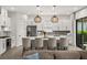 Modern kitchen features a center island, stainless appliances, and pendant lighting at 6266 Mesa Gln, Bradenton, FL 34203