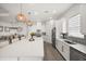 Bright, open kitchen boasts a large island, stainless appliances, and modern finishes at 6266 Mesa Gln, Bradenton, FL 34203
