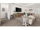 Open-concept living area with sleek flooring, a large television, and plenty of room to relax at 6266 Mesa Gln, Bradenton, FL 34203