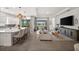 Open concept living space with a gourmet kitchen, comfortable seating, and views of the pool at 6266 Mesa Gln, Bradenton, FL 34203
