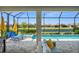 This patio offers a screened-in view of the pool and the water at 6266 Mesa Gln, Bradenton, FL 34203