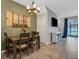 This dining area is adjacent to the kitchen and open to the living room with lots of natural light at 6516 Serenity Fall Ln, Sarasota, FL 34240