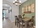 The dining area is connected to the living room and main entry with light pouring in the front door at 6516 Serenity Fall Ln, Sarasota, FL 34240