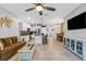 Spacious living room with open concept to kitchen and dining area, perfect for entertaining at 6516 Serenity Fall Ln, Sarasota, FL 34240
