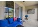Patio with an outdoor sofa, sliding door to backyard, and a grill at 6516 Serenity Fall Ln, Sarasota, FL 34240