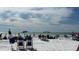 Siesta Beach scene with beachgoers enjoying the sunny day with umbrellas and chairs at 7209 35Th E St, Sarasota, FL 34243