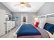 Bedroom with a white bed frame, TV, and access to outdoor pool area at 7209 35Th E St, Sarasota, FL 34243