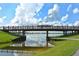 Scenic view of a wooden walking bridge spanning a waterway with reflection of clouds on a sunny day at 7209 35Th E St, Sarasota, FL 34243