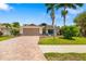 Lovely single-story home with a brick driveway and a two-car garage at 7209 35Th E St, Sarasota, FL 34243