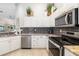 Bright kitchen with white cabinets, stainless steel appliances, and granite countertops at 7209 35Th E St, Sarasota, FL 34243