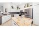 Kitchen with white cabinets, granite countertops, stainless appliances, and tile backsplash at 7209 35Th E St, Sarasota, FL 34243