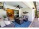 Relaxing outdoor patio with comfortable seating and a ceiling fan at 7209 35Th E St, Sarasota, FL 34243