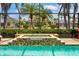 Screened-in pool area featuring a sparkling pool and a spa at 7209 35Th E St, Sarasota, FL 34243