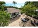 Expansive backyard featuring a patio, outdoor kitchen, dining area, and lounge seating, perfect for entertaining at 76 S Washington Dr, Sarasota, FL 34236
