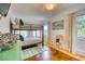bedroom featuring a bunk bed with colorful patterned bedding, hardwood floors, colorful decor and natural light at 76 S Washington Dr, Sarasota, FL 34236