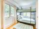 room featuring a modern bunk bed, hardwood floors and large windows providing ample natural light at 76 S Washington Dr, Sarasota, FL 34236