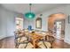 Elegant dining room featuring hardwood floors, seating for six and classic decor throughout at 76 S Washington Dr, Sarasota, FL 34236