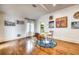 Dining and sitting area featuring hardwood floors, neutral walls and lots of natural light at 76 S Washington Dr, Sarasota, FL 34236