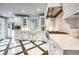 Well-equipped kitchen featuring custom cabinets, stainless steel appliances, and quartz countertops at 76 S Washington Dr, Sarasota, FL 34236