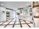 Spacious kitchen with stainless steel appliances, farmhouse sink, and ample counter space at 76 S Washington Dr, Sarasota, FL 34236