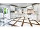 Beautiful kitchen with stainless steel appliances, breakfast bar, and open layout at 76 S Washington Dr, Sarasota, FL 34236