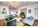 Bright and airy living room with stylish furnishings and ample seating for entertaining at 76 S Washington Dr, Sarasota, FL 34236