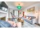 Elegant living room featuring a fireplace, stylish seating, and modern decor with large windows, offering natural light at 76 S Washington Dr, Sarasota, FL 34236