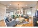 Spacious living room featuring hardwood floors, comfortable seating, and natural light at 76 S Washington Dr, Sarasota, FL 34236