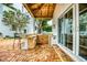 Outdoor kitchen features a built-in grill, sink, and bar area for outdoor dining and entertaining at 76 S Washington Dr, Sarasota, FL 34236