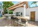 Spacious outdoor kitchen with bar seating and stylish countertops, ideal for entertaining and enjoying outdoor meals at 76 S Washington Dr, Sarasota, FL 34236