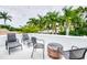 Inviting rooftop deck featuring comfortable seating arrangements and open views, perfect for relaxing or entertaining guests at 76 S Washington Dr, Sarasota, FL 34236