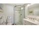 Clean bathroom with a glass-enclosed shower, modern vanity, and efficient use of space at 777 Beach Rd # 1B, Sarasota, FL 34242