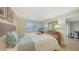 Bright bedroom featuring beach decor, a light color scheme, and a view of the outdoors at 777 Beach Rd # 1B, Sarasota, FL 34242