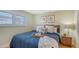Cozy bedroom featuring a comfortable bed, natural lighting, and beach-themed decor at 777 Beach Rd # 1B, Sarasota, FL 34242