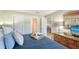 Bedroom boasting ample natural light, cozy decor, and easy access to the bathroom and dining area at 777 Beach Rd # 1B, Sarasota, FL 34242