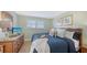 Bedroom with a TV on a dresser and decor that enhances the cozy and inviting atmosphere at 777 Beach Rd # 1B, Sarasota, FL 34242