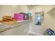 Walk-in closet provides ample storage space, shelving, and a mirror, enhancing organization at 777 Beach Rd # 1B, Sarasota, FL 34242